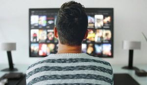 man watching movie online