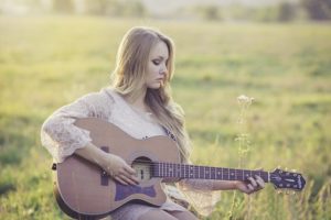 woman playing guitar